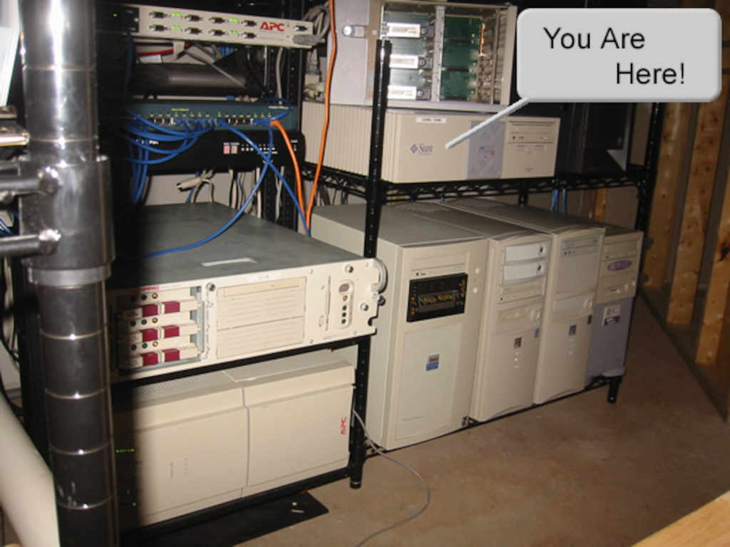 A shelving unit full of tower PCs. There is an speech bubble and the words, "you are here"