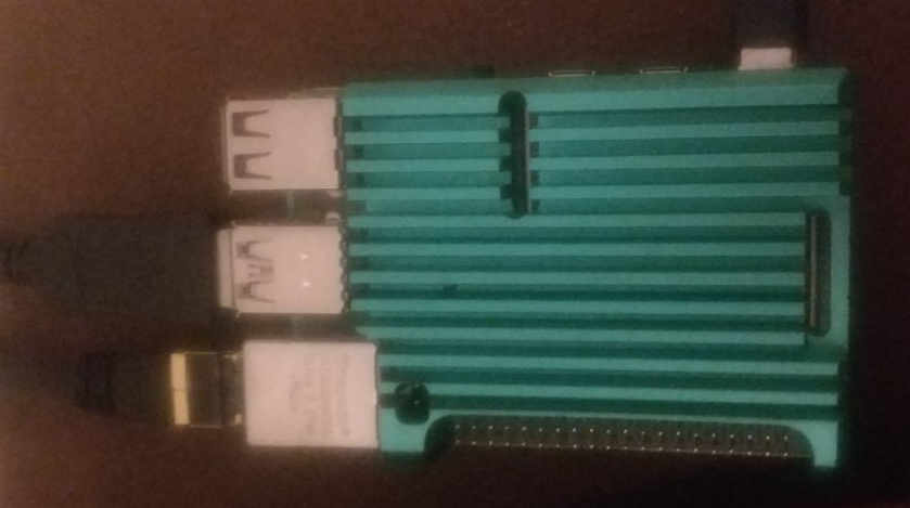 The raspberry Pi in a sexy green aluminium heatsink case