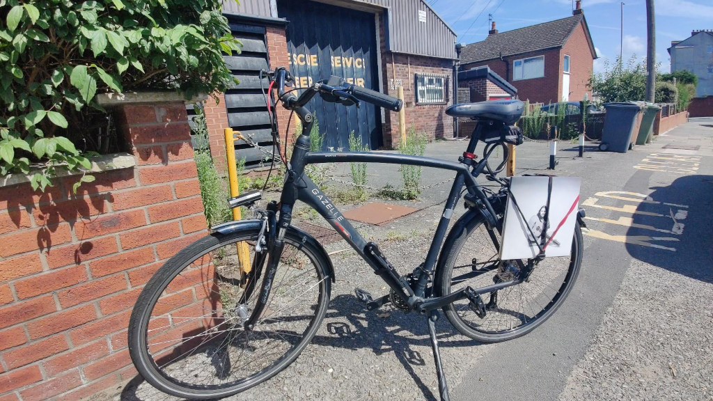 a bicycle with LPs strapped to the side